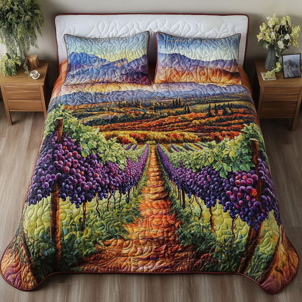 Vineyard Indulgence quilted 3-piece bedding set on a made bed with two matching pillow shams