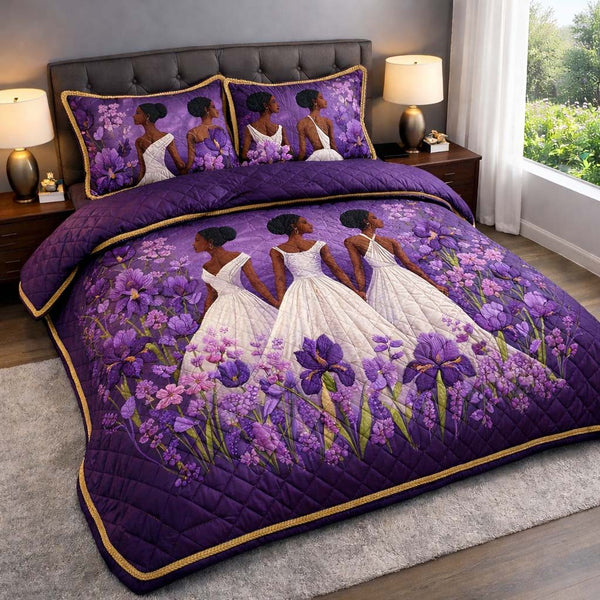 Violet Elegance quilted 3-piece bedding set on a made bed with two matching pillow shams