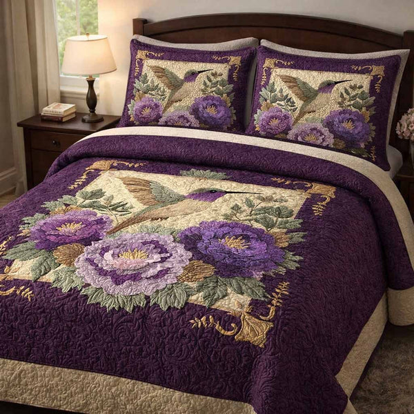 Violet Garden quilted 3-piece bedding set on a made bed with two matching pillow shams
