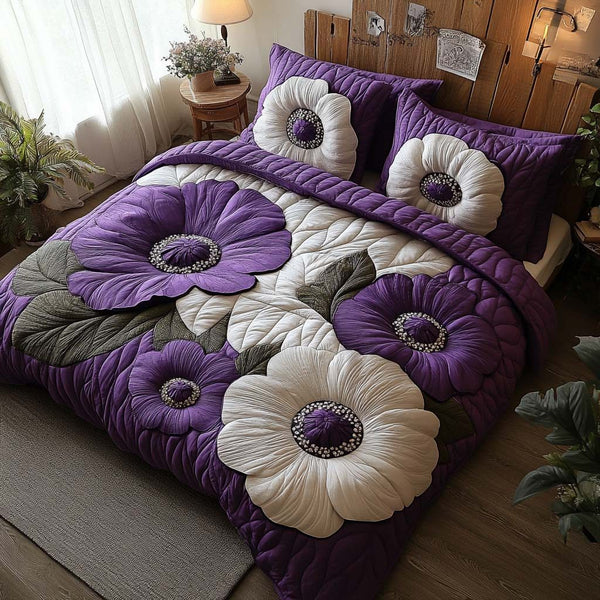 Violet Poppy Glow quilted 3-piece bedding set on a made bed with two matching pillow shams