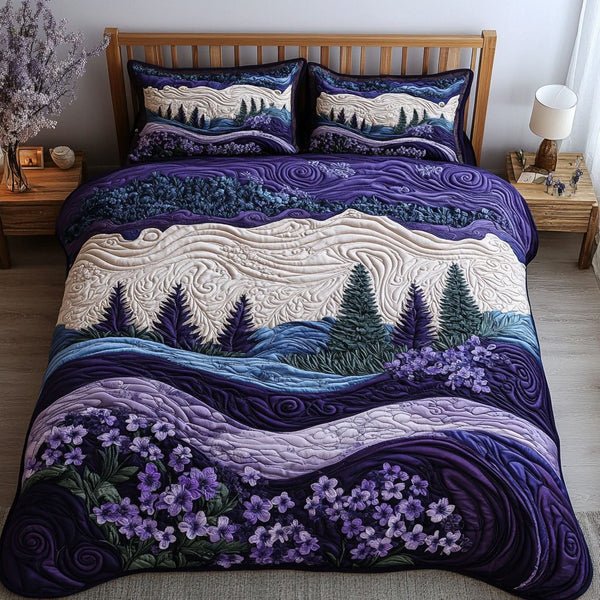 Violet Reflections quilted 3-piece bedding set on a made bed with two matching pillow shams