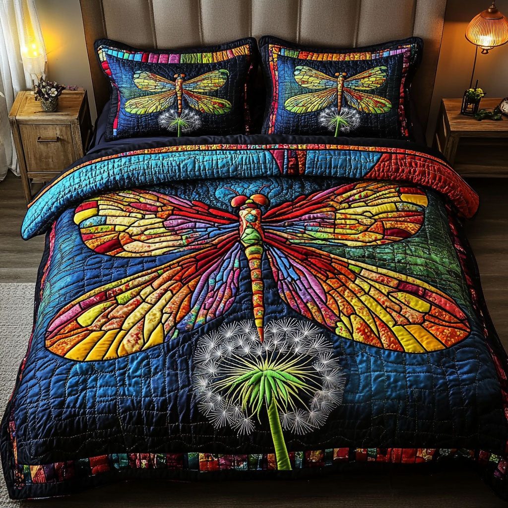 Vivid Dragonfly quilted 3-piece bedding set on a made bed with two matching pillow shams