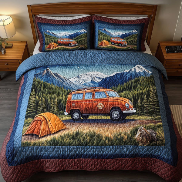 Wanderlust Retreat quilted 3-piece bedding set on a made bed with two matching pillow shams