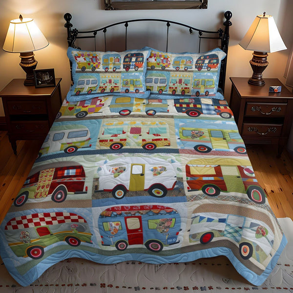 Wanderlust Wheels quilted 3-piece bedding set on a made bed with two matching pillow shams