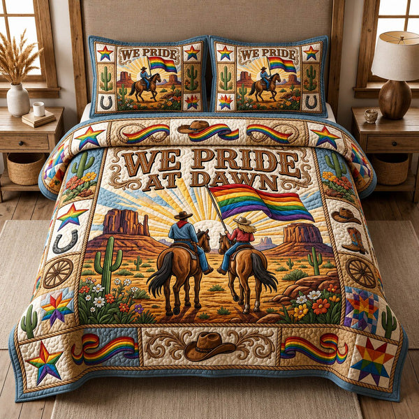 We Pride At Dawn quilted 3-piece bedding set on a made bed with two matching pillow shams