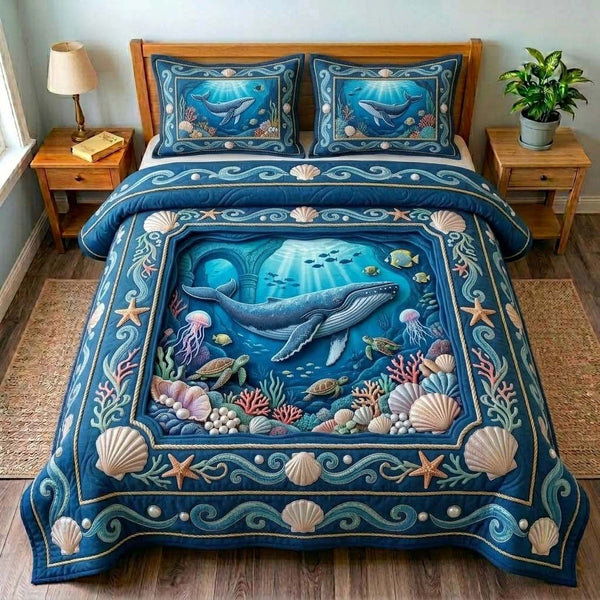 Whale Reef Window quilted 3-piece bedding set on a made bed in a light coastal bedroom