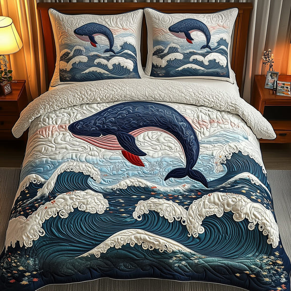 Whale Serenity quilted 3-piece bedding set on a made bed in a light coastal bedroom