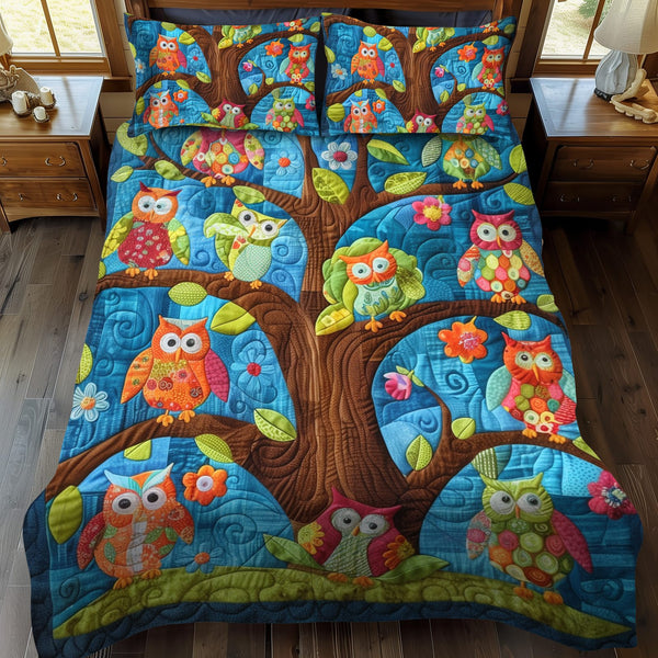 Whimsical Owls quilted 3-piece bedding set on a made bed with two matching pillow shams