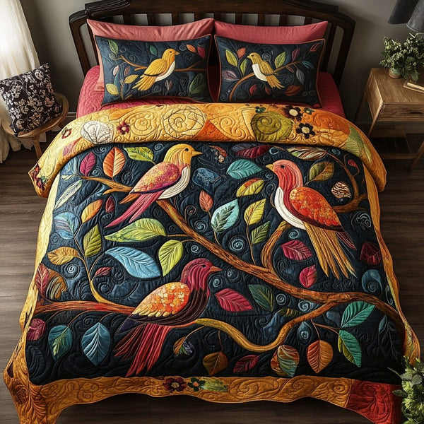 Whimsical Wings quilted 3-piece bedding set on a made bed with two matching pillow shams