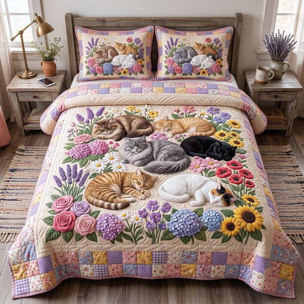 Whiskers Garden quilted 3-piece bedding set on a made bed with two matching pillow shams