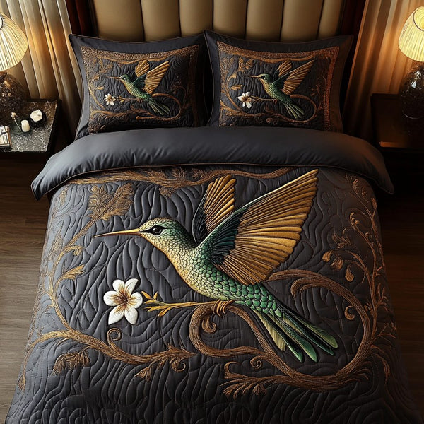Whisper Flight quilted 3-piece bedding set on a made bed with two matching pillow shams