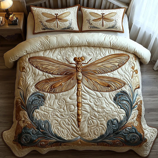 Whispering Dragonfly quilted 3-piece bedding set on a made bed with two matching pillow shams