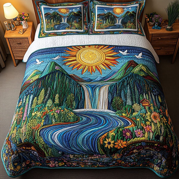 Whispering Falls quilted 3-piece bedding set on a made bed with two matching pillow shams