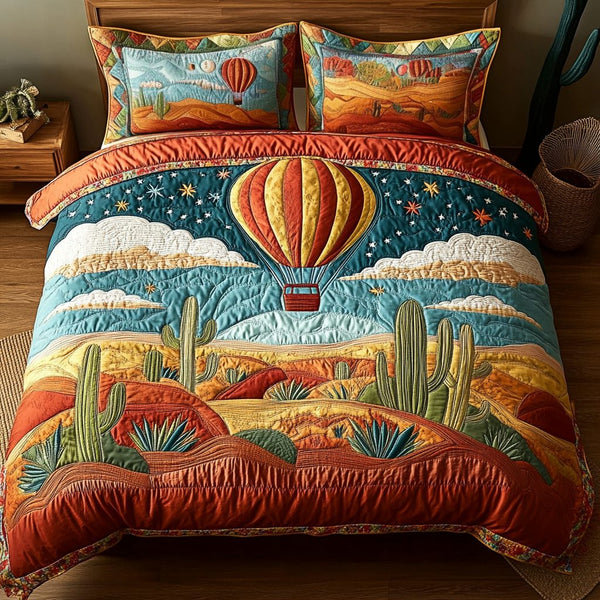 Whispering Winds quilted 3-piece bedding set on a made bed with two matching pillow shams