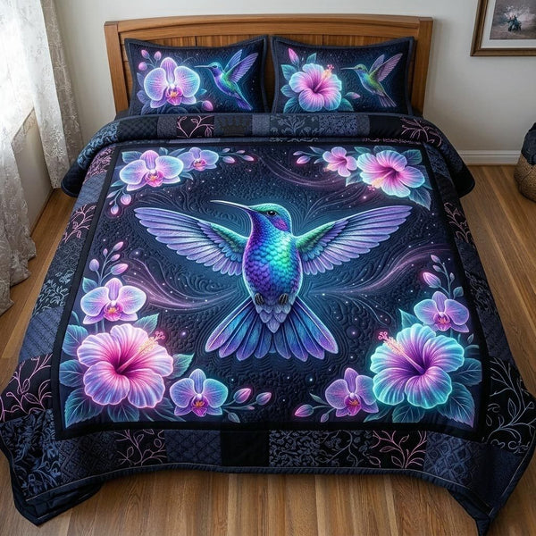 Whispering Wings quilted 3-piece bedding set on a made bed with two matching pillow shams