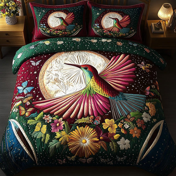 Whispering Wings quilted 3-piece bedding set on a made bed with two matching pillow shams