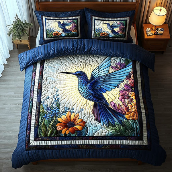 Whispering Wings quilted 3-piece bedding set on a made bed with two matching pillow shams
