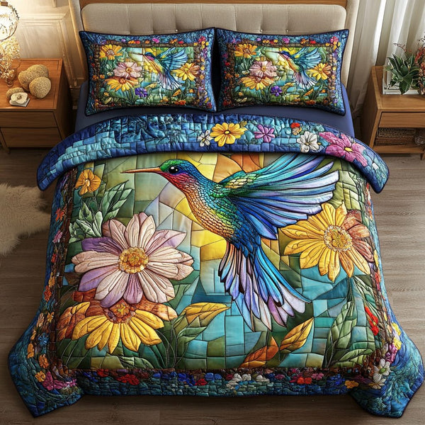 Whispering Wings quilted 3-piece bedding set on a made bed with two matching pillow shams