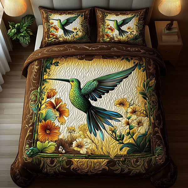 Whispering Wings quilted 3-piece bedding set on a made bed with two matching pillow shams