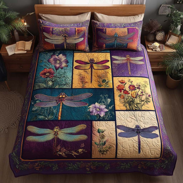 Whispering Wings quilted 3-piece bedding set on a made bed with two matching pillow shams