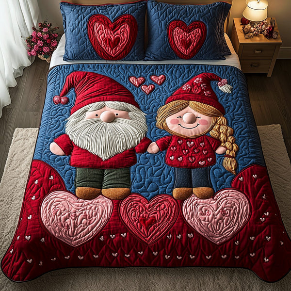Whispers of Love quilted 3-piece bedding set on a made bed with two matching pillow shams