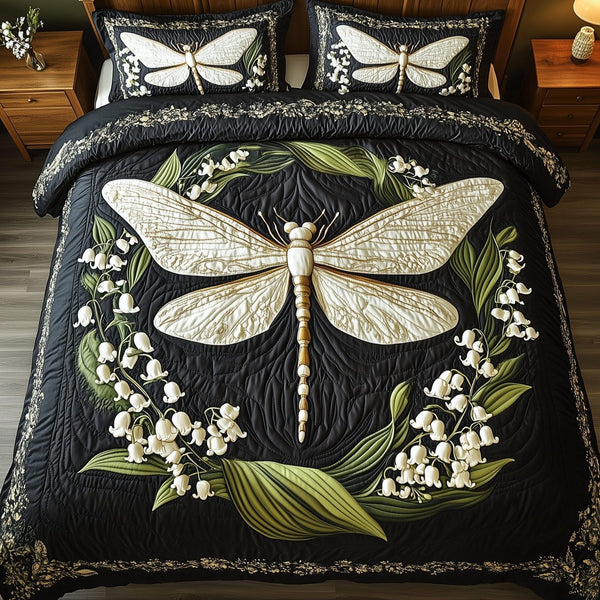 Whispers of the Valley quilted 3-piece bedding set on a made bed with two matching pillow shams