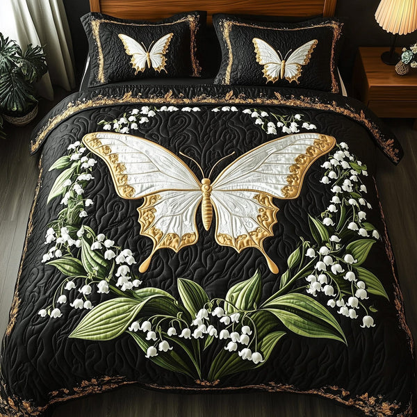 Whispers of the Valley quilted 3-piece bedding set on a made bed with two matching pillow shams