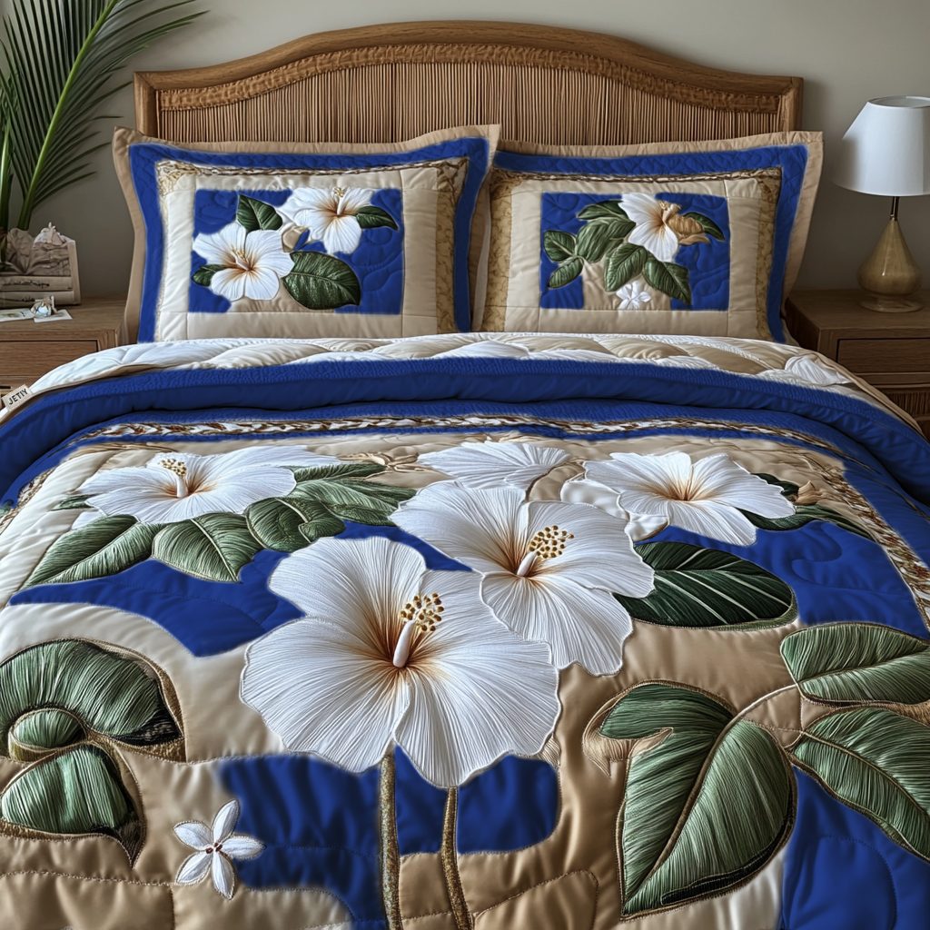 White Hibiscus v2 quilted 3-piece bedding set on a made bed with two matching pillow shams