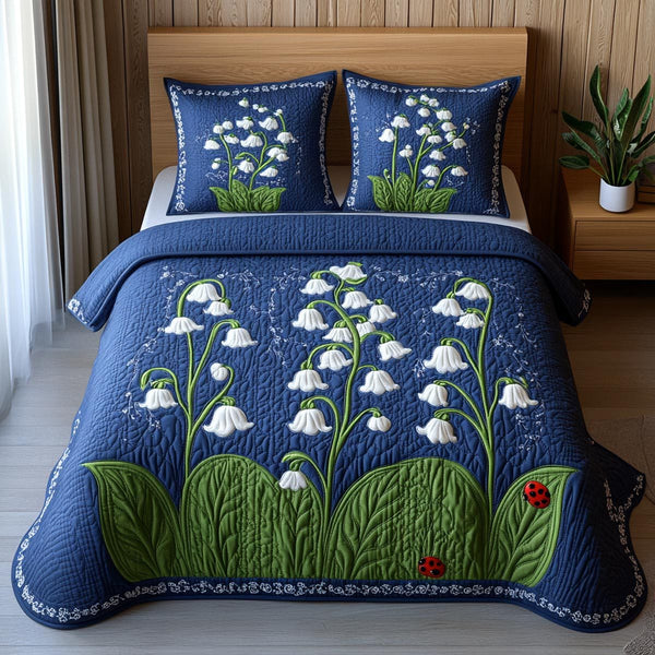 White Lily quilted 3-piece bedding set on a made bed with two matching pillow shams