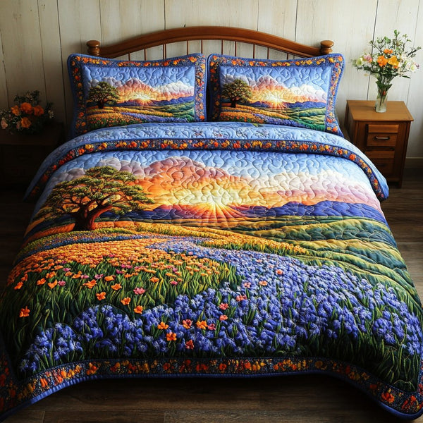 Wild Bluebonnets quilted 3-piece bedding set on a made bed with two matching pillow shams