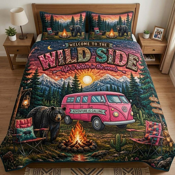 Wild Camp quilted 3-piece bedding set on a made bed with two matching pillow shams