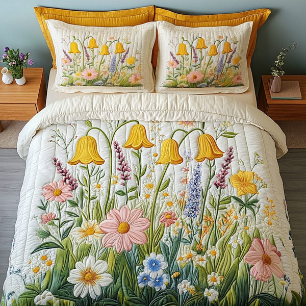Wild Meadow quilted 3-piece bedding set on a made bed with two matching pillow shams