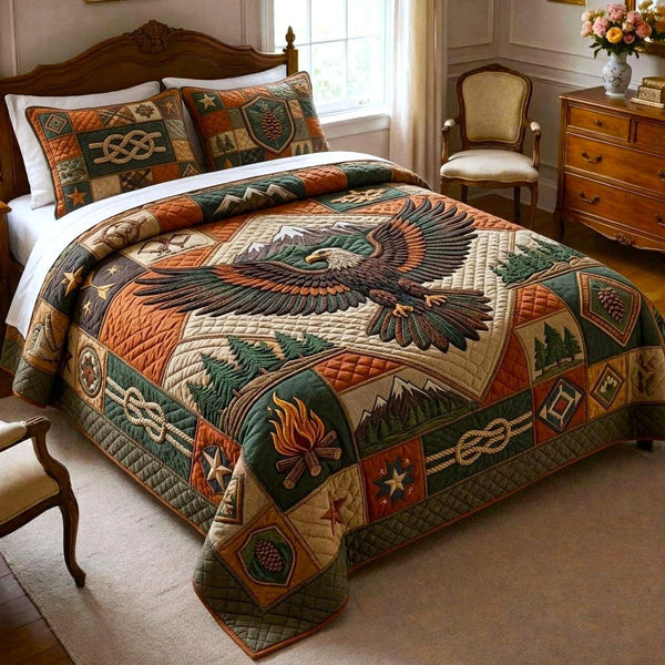 Wilderness Crew quilted 3-piece bedding set on a made bed with two matching pillow shams