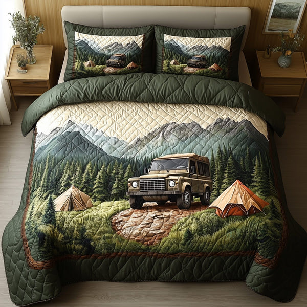Wilderness Wander quilted 3-piece bedding set on a made bed with two matching pillow shams