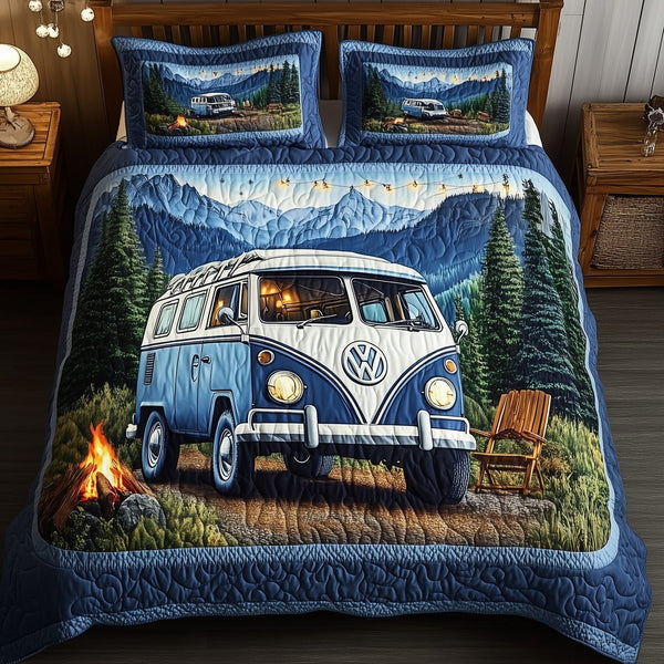 Wilderness Wander quilted 3-piece bedding set on a made bed with two matching pillow shams