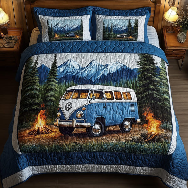 Wilderness Wander quilted 3-piece bedding set on a made bed with two matching pillow shams