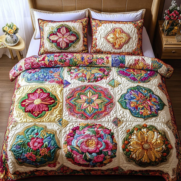 Wildflower Glow quilted 3-piece bedding set on a made bed with two matching pillow shams