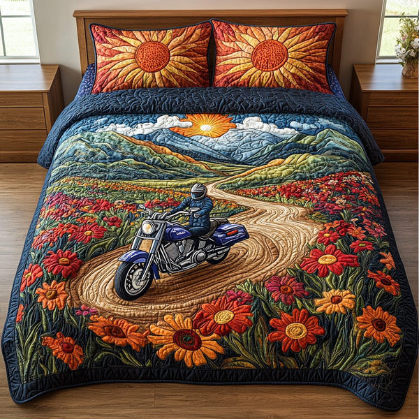 Wildflower Ride quilted 3-piece bedding set on a made bed with two matching pillow shams