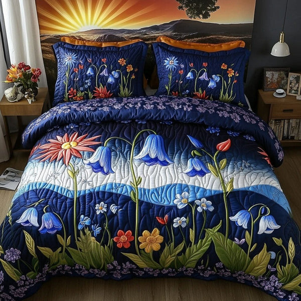 Wildflower Serenade quilted 3-piece bedding set on a made bed with two matching pillow shams