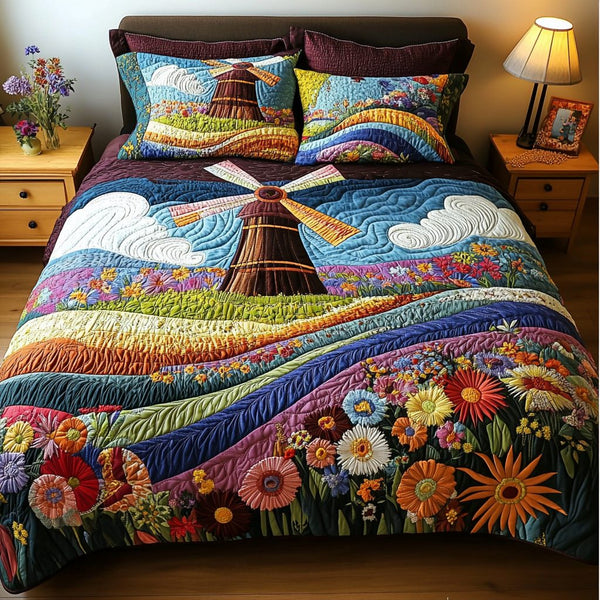 Wind Bloom quilted 3-piece bedding set on a made bed with two matching pillow shams