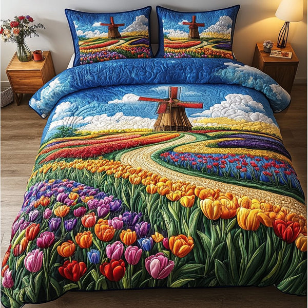 Windmill Dreams quilted 3-piece bedding set on a made bed with two matching pillow shams