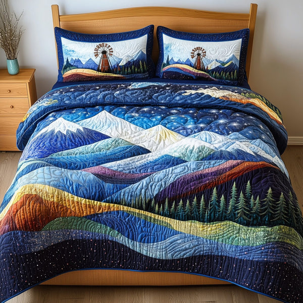 Windmill In Stillness quilted 3-piece bedding set on a made bed with two matching pillow shams