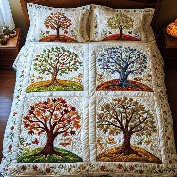 Winds of Renewal quilted 3-piece bedding set on a made bed with two matching pillow shams