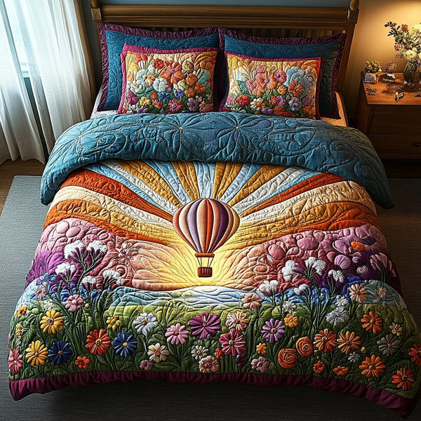 Winds of Wonder quilted 3-piece bedding set on a made bed with two matching pillow shams
