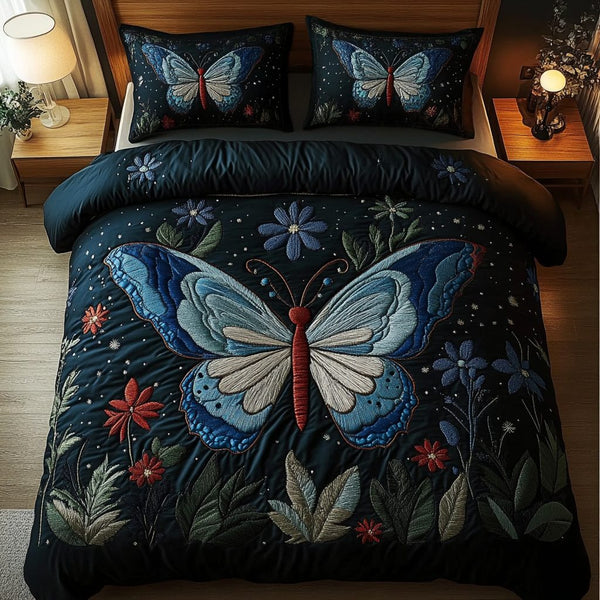 Winged Beauty quilted 3-piece bedding set on a made bed with two matching pillow shams