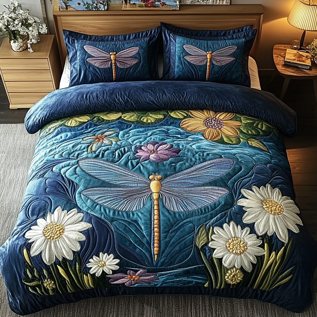 Winged Beauty quilted 3-piece bedding set on a made bed with two matching pillow shams
