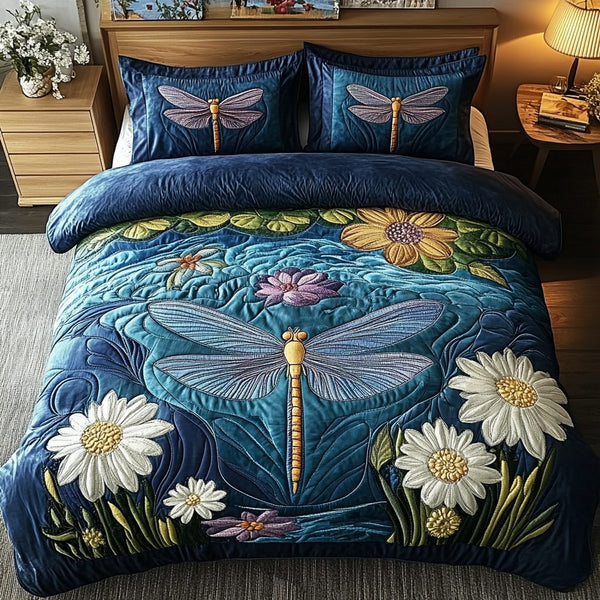 Winged Beauty quilted 3-piece bedding set on a made bed with two matching pillow shams