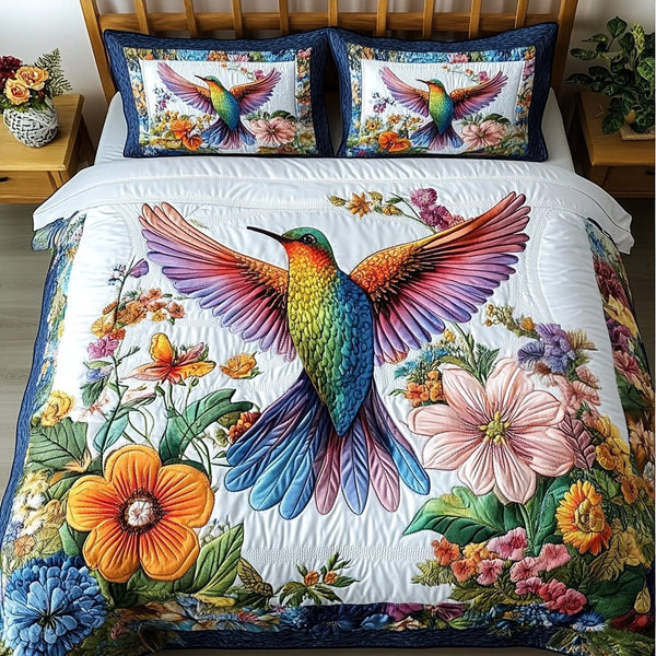 Winged Dream quilted 3-piece bedding set on a made bed with two matching pillow shams