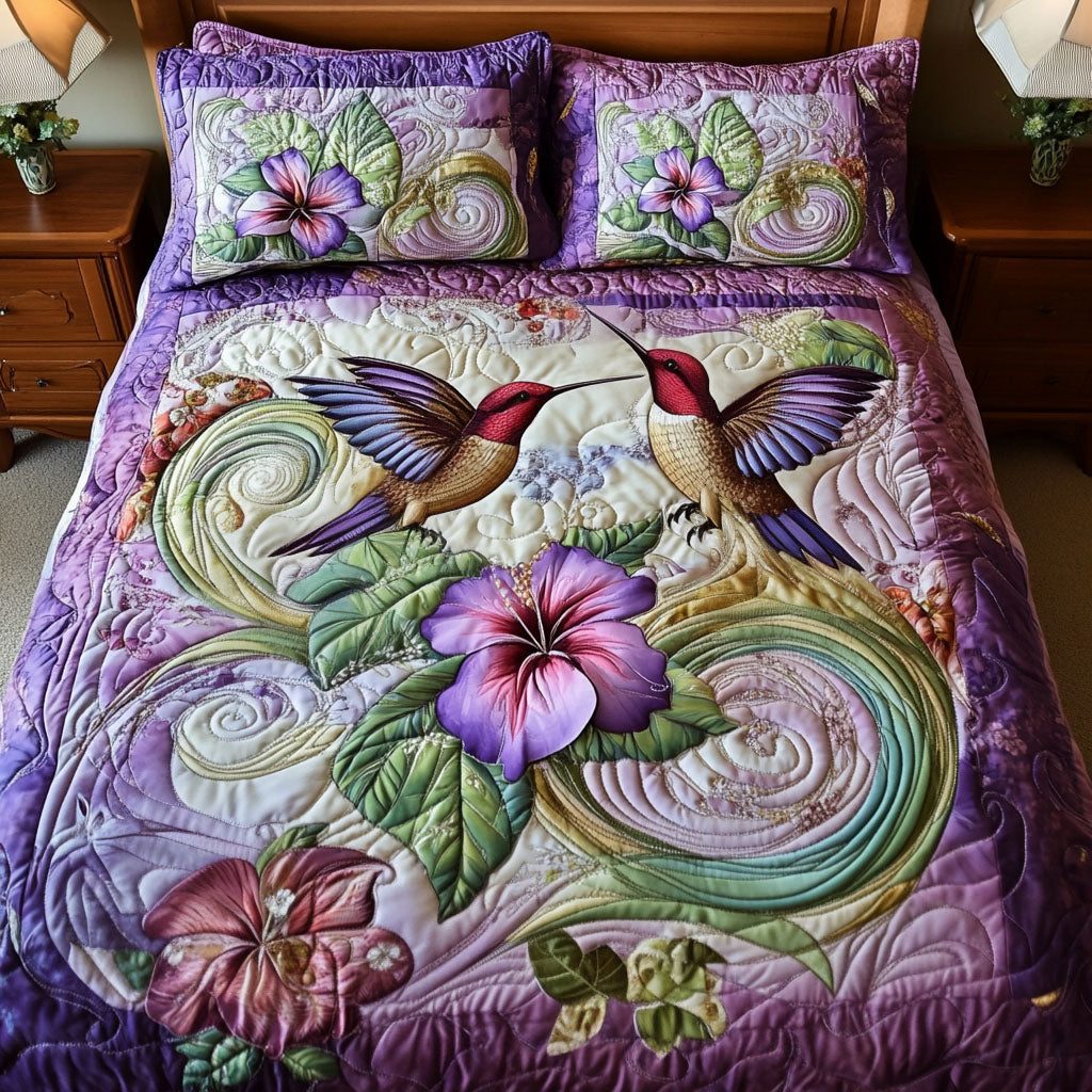 Winged Harmony quilted 3-piece bedding set on a made bed with two matching pillow shams
