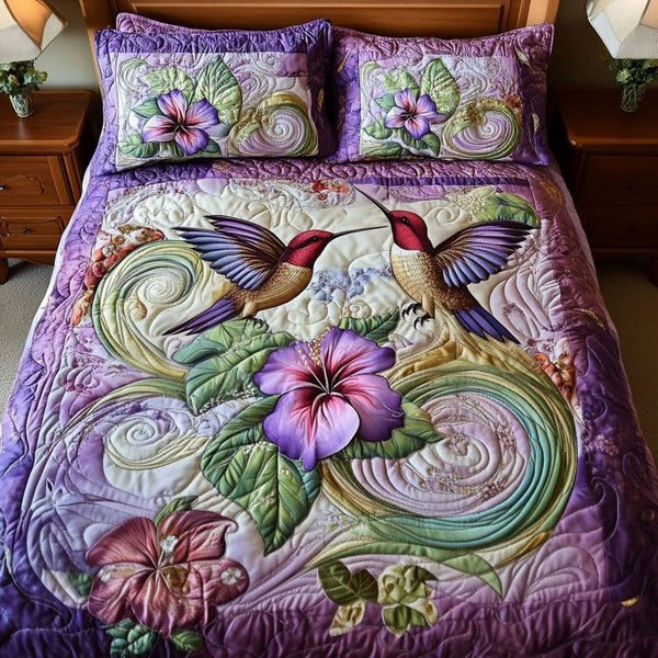 Winged Harmony quilted 3-piece bedding set on a made bed with two matching pillow shams